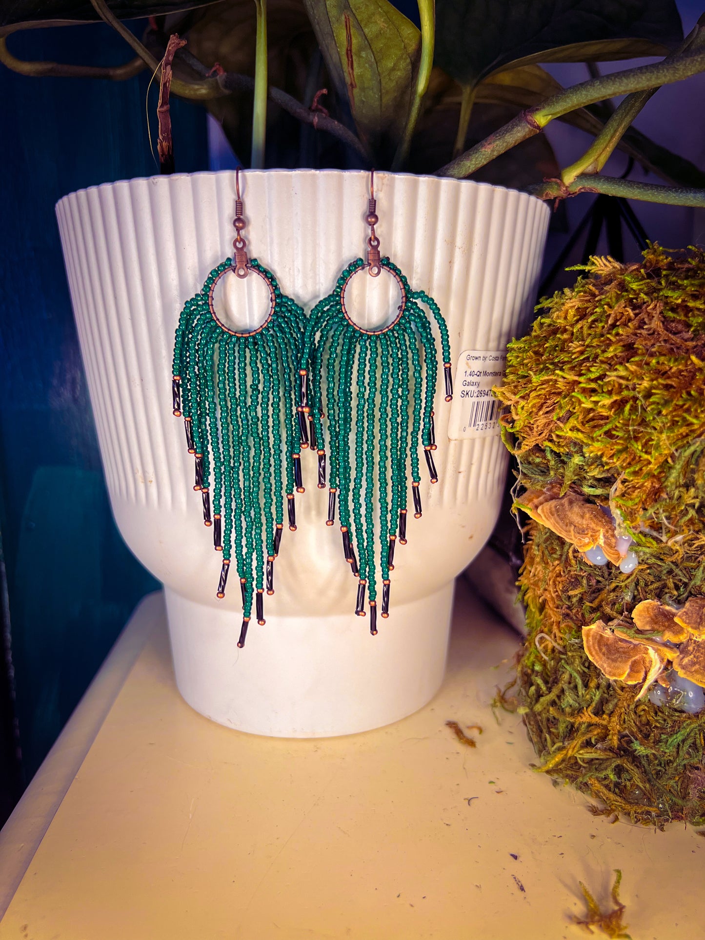Green med length beaded earrings